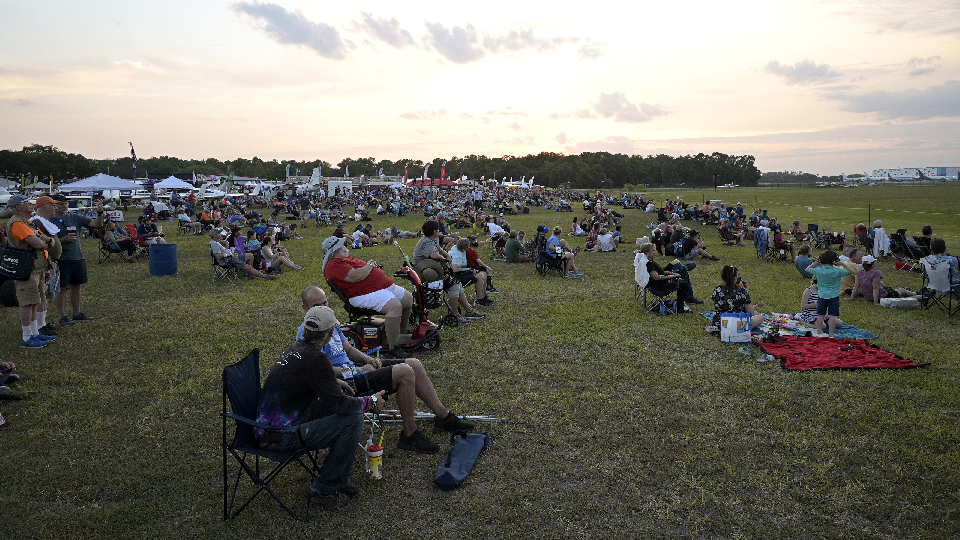 A crowd gathers to watch the Sun 'n Fun Aerospace Expo night airshow on April 14. Photo by Phelan M. Ebenhack.