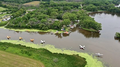 Floatplanes dot the EAA Seaplane Base cove during EAA AirVenture. Photo by David Tulis.