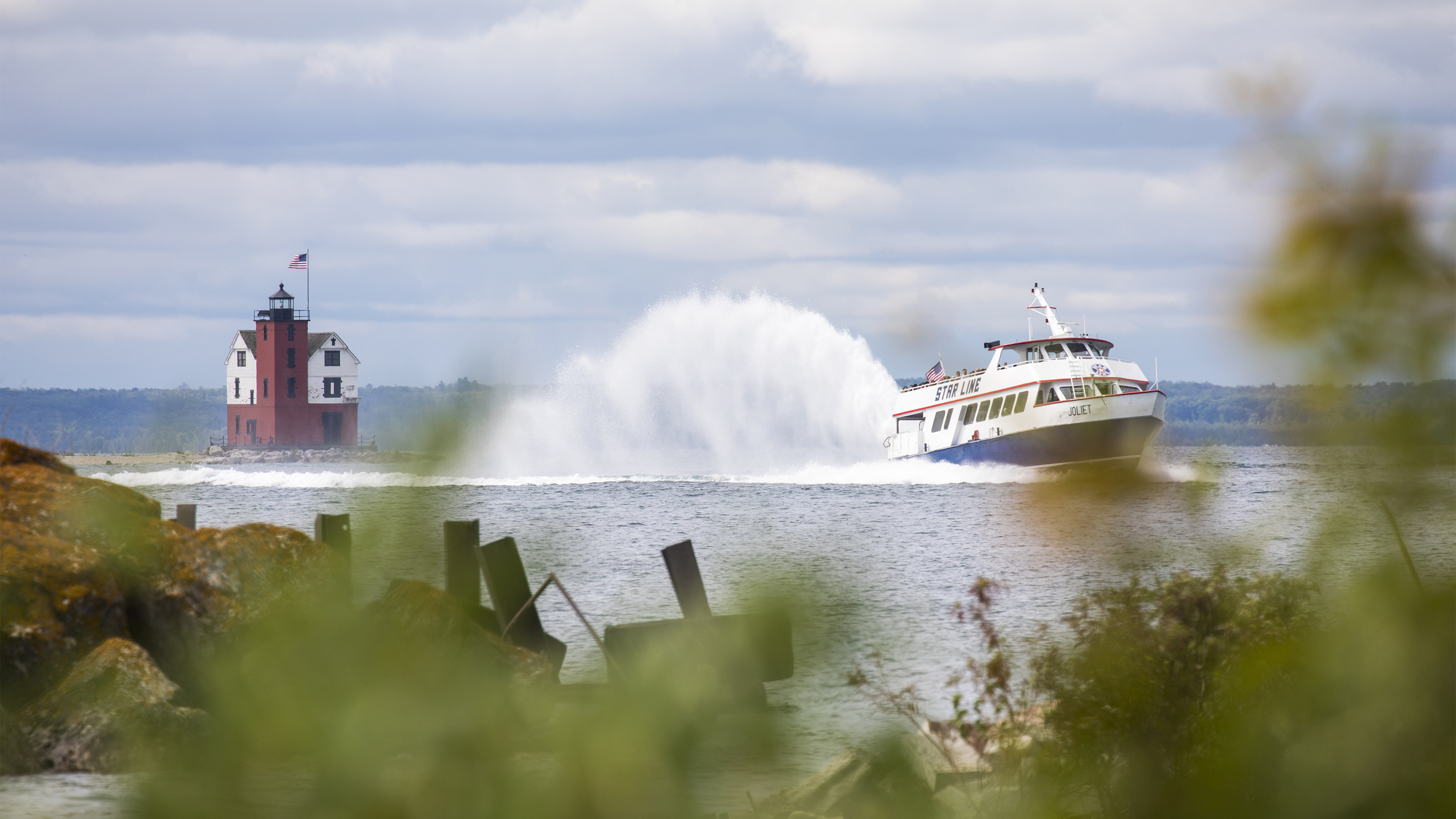 Ferries navigate the Straits of Mackinac bringing tourists to and from the island. Photo courtesy of the Mackinac Island Tourism Bureau. 