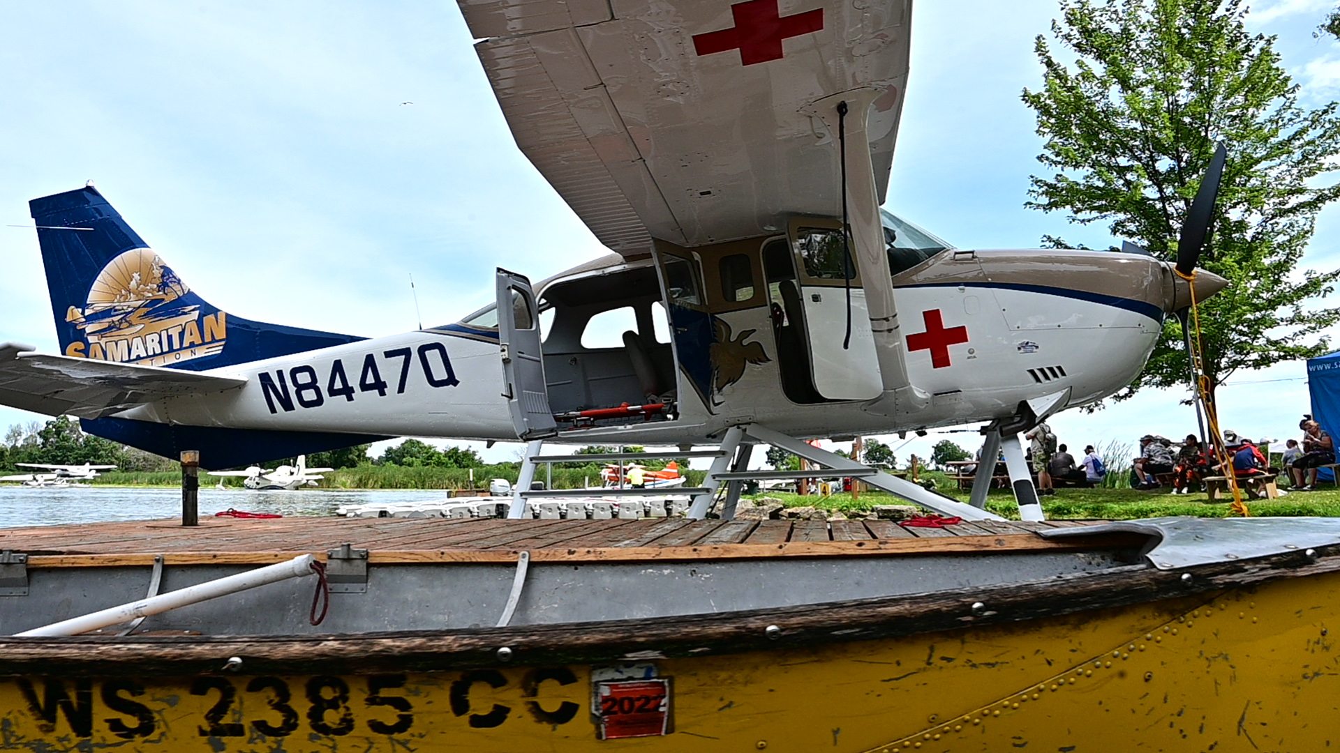 A Samaritan Aviation Cessna 206 is docked at the EAA Seaplane Base during AirVenture in Oshkosh, Wisconsin. Photo by David Tulis.