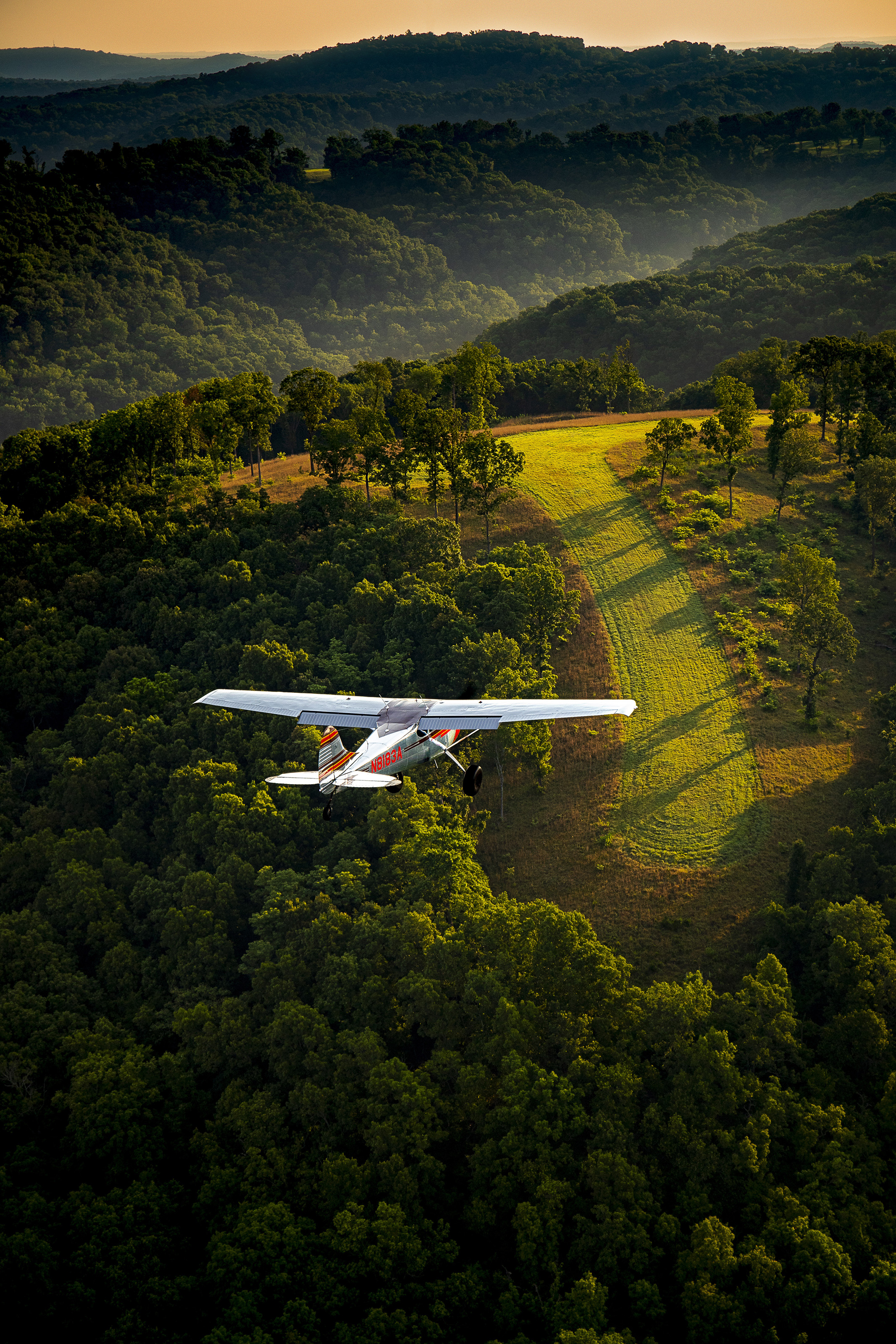 Dave Powell pilots his Cessna 170B over one of five airstrips located at Bank’s Ranch in the Ozark Mountains in northwest Arkansas.Bentonville Municipal Airport (KVBT)Bentonville, AR USA