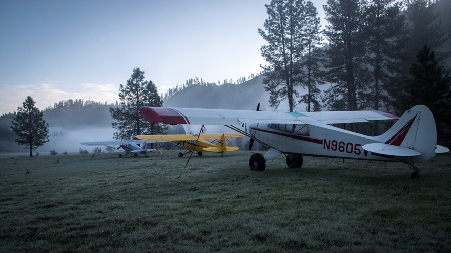 Ridgeline Aviation often operates instructional trips that double as a fun bonding experience for students and instructors. Here the fleet rests at the Shearer U.S. Forestry Service strip in Idaho. Photo courtesy of Ridgeline Aviation.