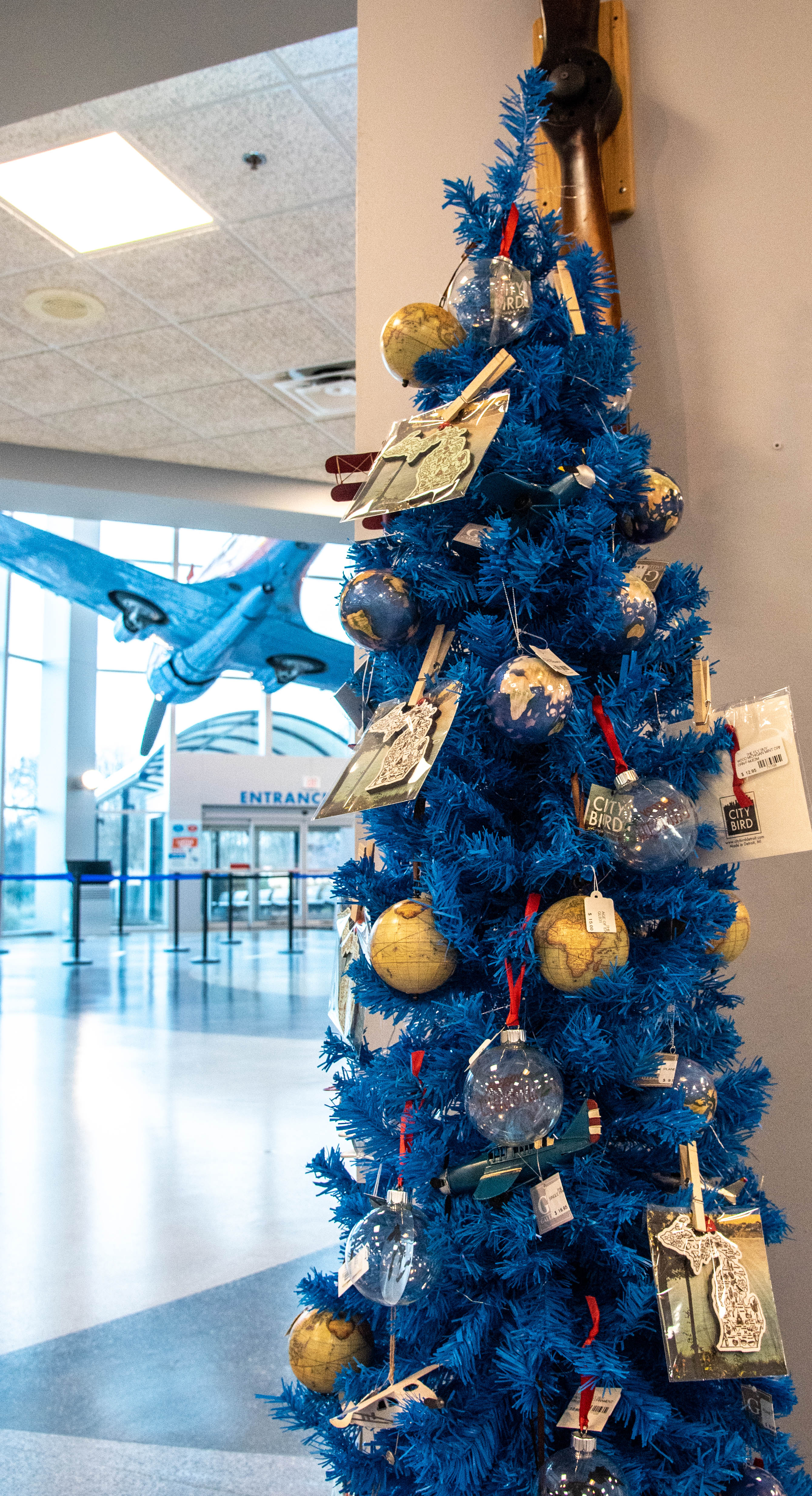 A Christmas tree adorned with aviation themed ornaments and cards stands in the front lobby of the Air Zoo. Photo courtesy of The Air Zoo.