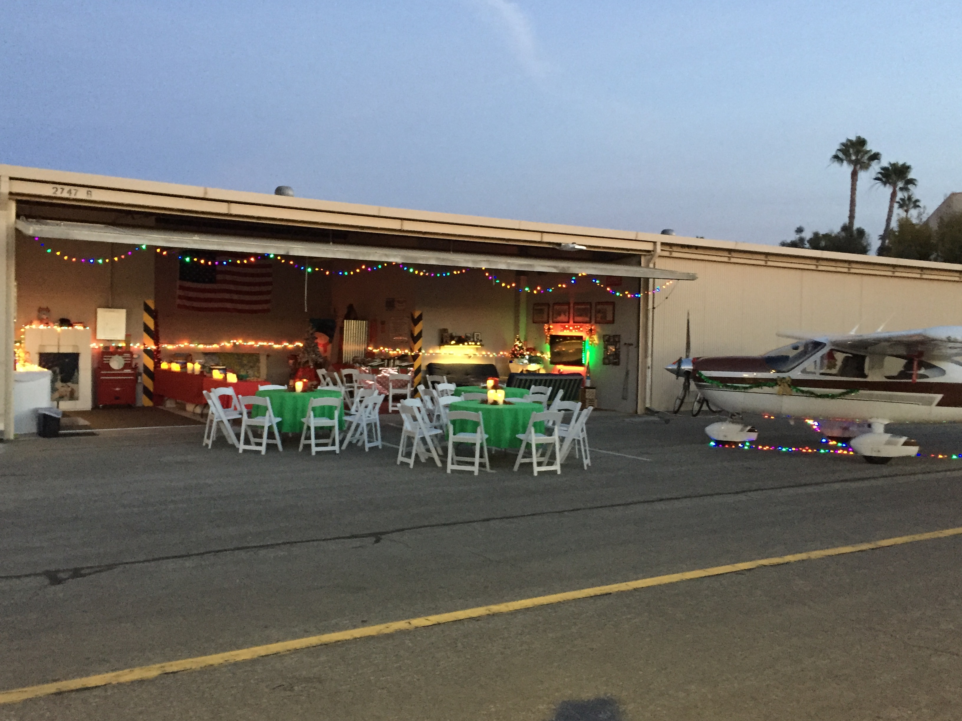 Pilots at Zamperini Field enjoy a festive holiday hangar party complete with decorated aircraft and hangars. Photo courtesy of Michael Haworth. 