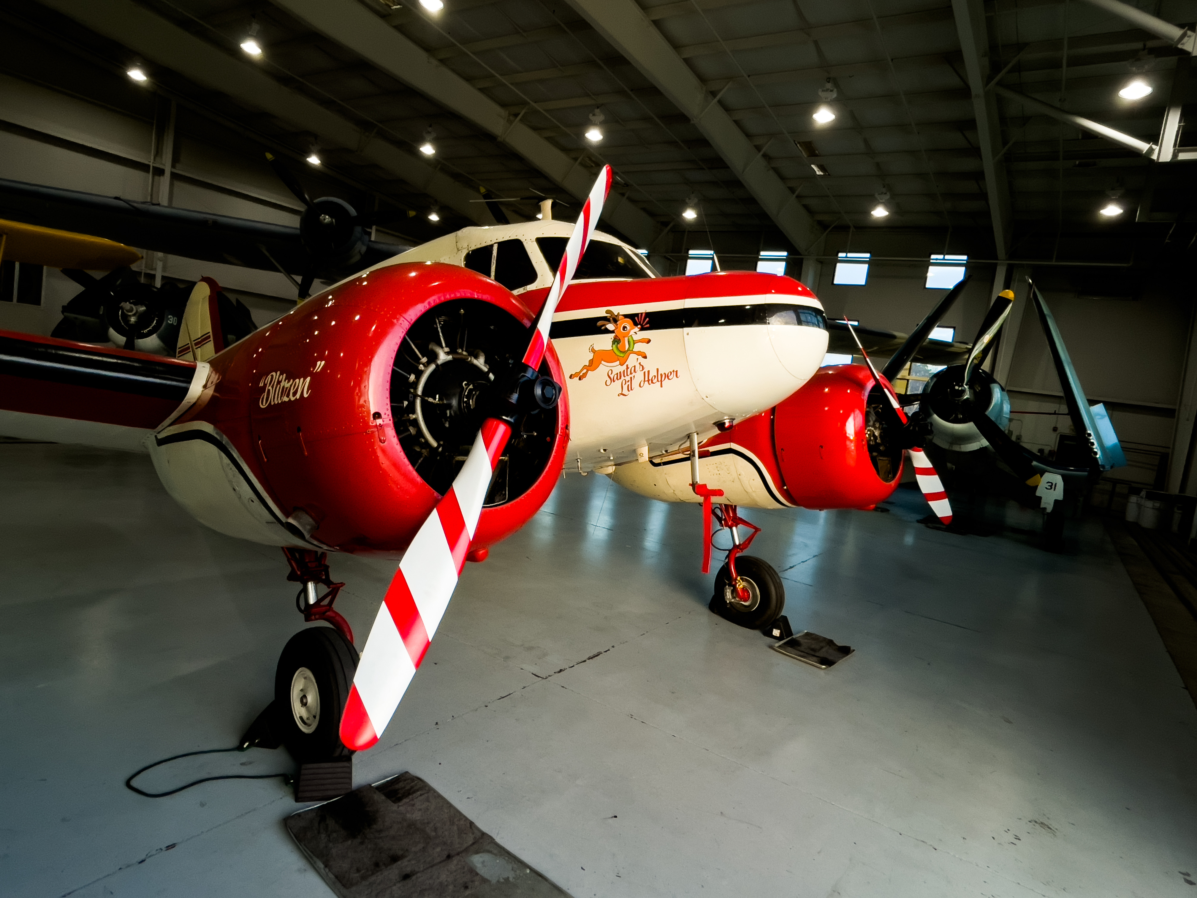 The North Pole Express, adorned with Christmas accoutrements, sits festively at the Military Aviation Museum in Virginia Beach, Virginia. Photo courtesy of Zachary Baughman, Military Aviation Museum. 