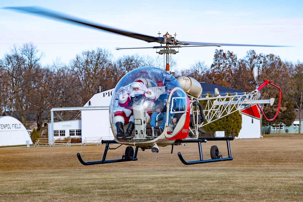 As part of the EAA Aviation Museum’s Christmas in the Air open house Santa also made an appearance, this time in a rotorcraft. Photo by Connor Madison.