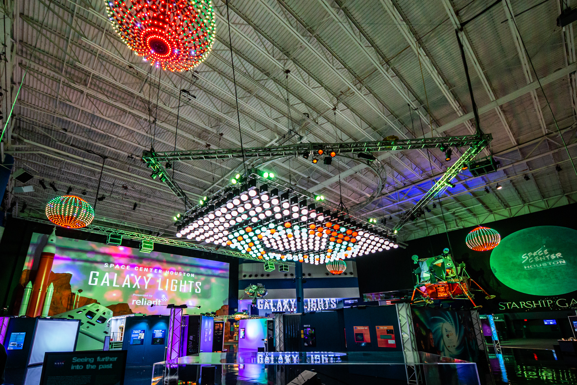 Guests at Space Center Houston’s Galaxy Lights, presented by Reliant, will experience two high-tech kinetic light shows, supported by Wellby Financial, where dozens of suspended lights move in precise choreographed sequences to music above the Main Plaza. Photo courtesy of Space Center Houston. 