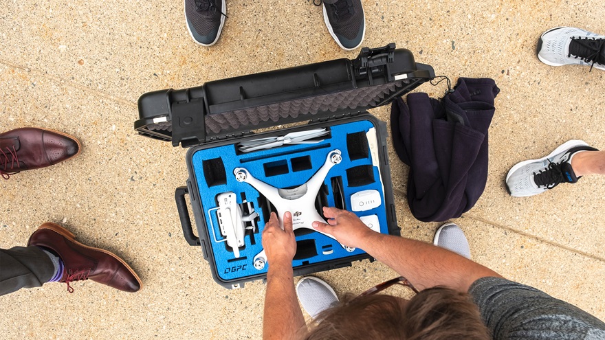 Students working toward their Part 107 certificate unbox a drone for flight. Photography courtesy of Hyvion.
