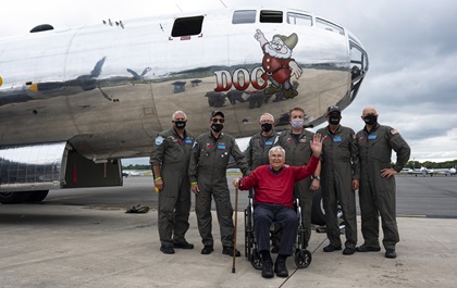 Retired U.S. Air Force Lt. Col. Bob Vaucher, who flew Boeing B-29 Superfortresses during World War II, joins the B-29 "Doc" crew at Manassas Regional Airport/Harry P. Davis Field after a local flight in the aircraft that had been scheduled to take part in the Arsenal of Democracy flyover of Washington, D.C., before it was scrubbed for weather. Photo by David Tulis.       