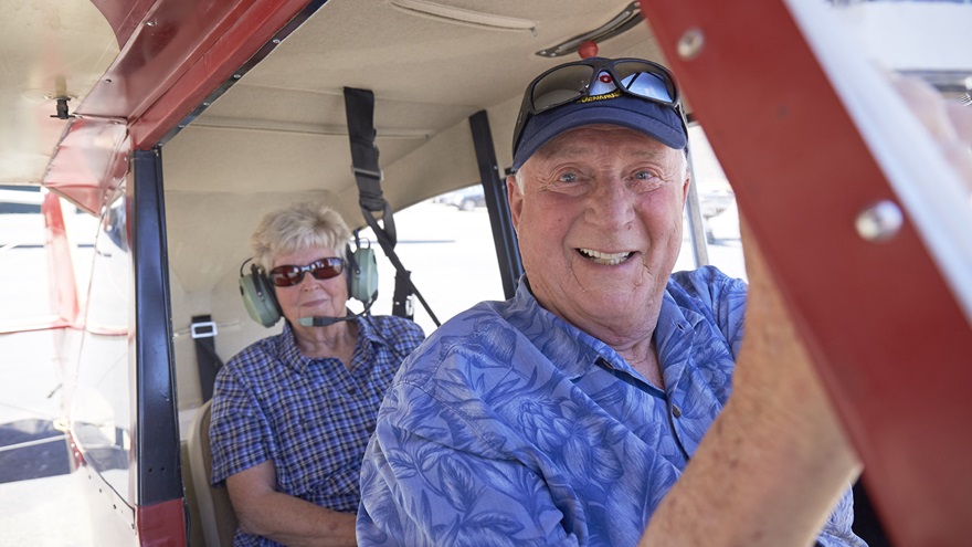 Barry Schiff celebrated his eightieth birthday in 2018 by flying, and giving rides, in the Aeronca Champ he soloed in. Barry is pictured here with his high school friend Diane Ferree. Photo by Mike Fizer.
