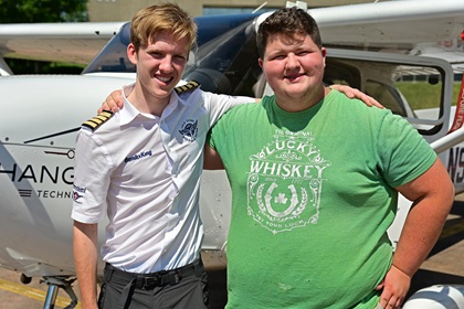 British pilot Travis Ludlow, 18, meets Virginia pilot Leo Middleton, 17, who flew to Frederick Municipal Airport in Frederick, Maryland, to offer encouragement during Ludlow’s attempted solo global circumnavigation. Photo by David Tulis.                      