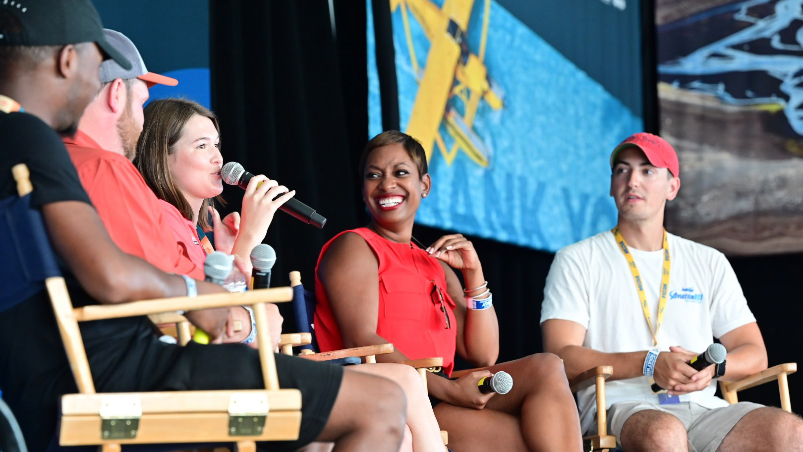 Courtland Savage, Chris Palmer, Cayla McLeod, Kellee Edwards, and Josh Flowers participate in a social media panel on the AOPA campus during EAA AirVenture July 27.  Photo by David Tulis.