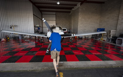 Pilots to the Rescue founder Michael Schneider pushes a Piper Turbo Saratoga SP into the hangar at Essex County Airport in New Jersey. Photo by David Tulis.