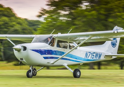 A Flyt Aviation pilot waves after landing in a Cessna 172 Skyhawk during Vintage Day at Peach State Aerodrome in Williamson, Georgia. Photo courtesy of Leigh Hubner.