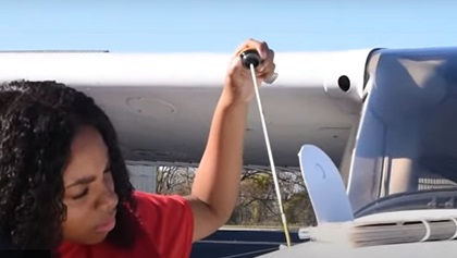 Elexis Martin, a student at Steubenville High School in Ohio, checks the aircraft’s oil level during preflight. Martin is enrolled in the AOPA You Can Fly High School Aviation STEM Curriculum and is working toward her private pilot certificate.