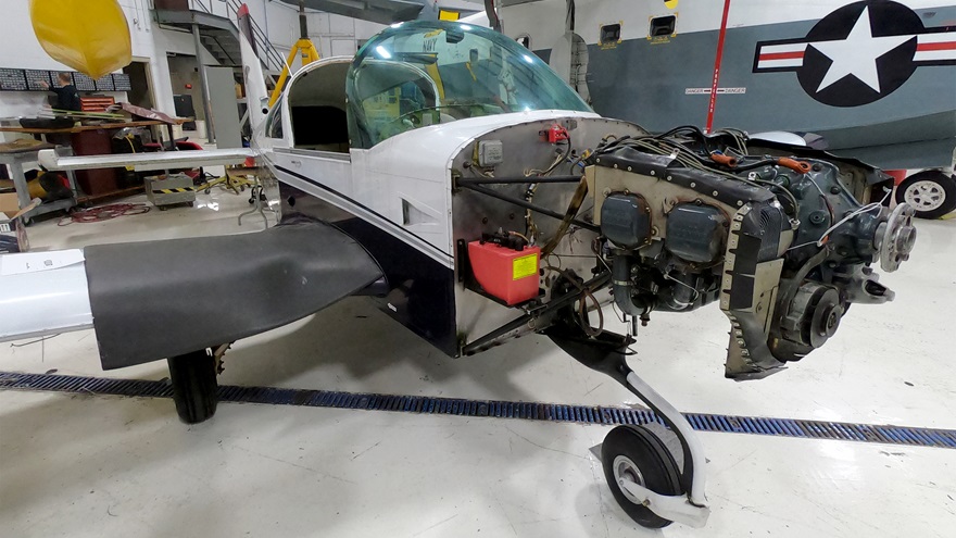 The AOPA Sweepstakes Grumman Tiger, nestled under a Grumman HU-16 Albatross, is awaiting modifications at J.A. Air Center. Photo by Kollin Stagnito.