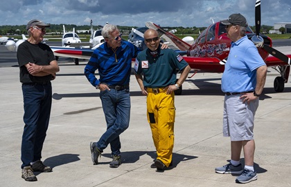 Shinji Maeda and Adrian Eichhorn are joined by earthrounders Bill Harrelson and Adam Broome during a sendoff at Manassas Regional Airport/Harry P. Davis Field in Virginia. Photo by David Tulis.