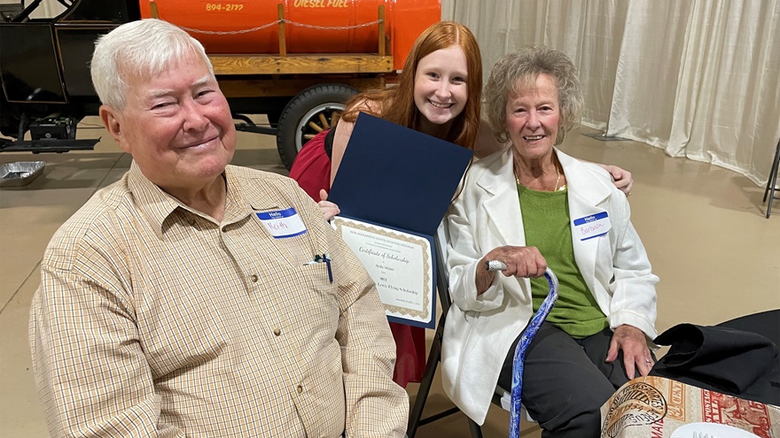 Ron Alexander Youth Aviation Program student Ayala Weiner was presented with the Barbara Kitchens Lewis Flying Scholarship in October. She is pictured with Barbara Kitchens Lewis and her husband, Keith Lewis. Photo by Cayla McLeod. 