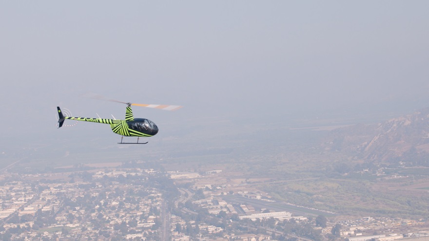 Skyryse has automated a Robinson R44 to the point where a person with no pilot training can learn in a few minutes to guide the aircraft using a tablet and joystick. (Photo courtesy of PRNewsfoto/SkyRyse.)