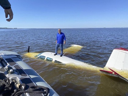 Federal agents and local sheriff's deputies conducting an offshore operation near Cedar Key, Florida, on November 9 came across this pilot as he was extricating himself from a sinking Beechcraft Bonanza. Image courtesy of U.S. Customs and Border Protection.