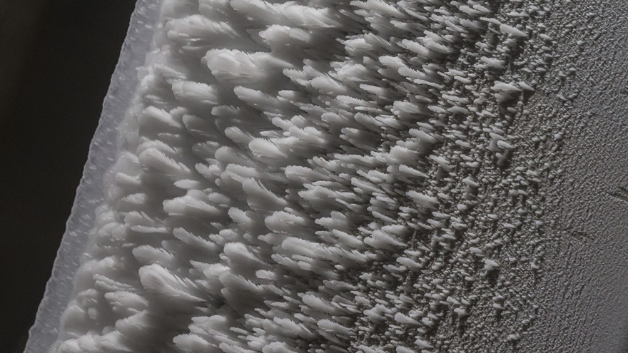 Various ice formations appear on this wing section at the NASA Glenn Research Center's Icing Research Tunnel. Photo by Mike Fizer.