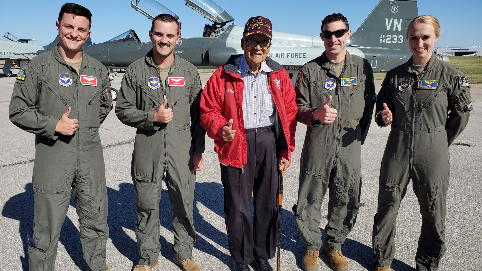 An impromptu meeting between Brig. Gen. Charles McGee and a group of U.S. Air Force pilots during a fuel stop at Wichita Dwight D. Eisenhower National Airport in Wichita, Kansas,  was a highlight of the flight to Los Angeles for McGee’s ceremony. McGee provided words of encouragement and posed for selfies with T-38 and T-6 students. Photo by Vincent Mickens.