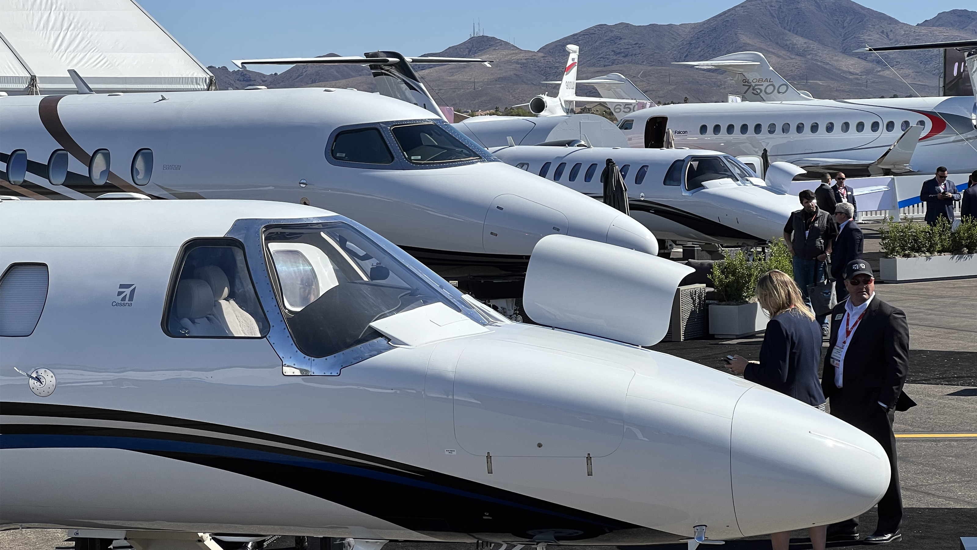 Business jets from Textron Aviation, Bombardier, and Dassault crowd the ramp, vying for attention from attendees at the National Business Aviation Association Business Aviation Convention and Exhibition in Las Vegas. Photo by Paul Harrop. 
