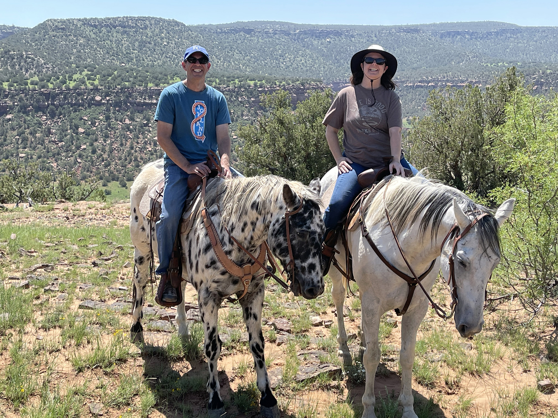 The author and her husband exploring some of the 14,000 acres at Canyon Madness Ranch in northeastern New Mexico. The ranch has a full equestrian program and staff can customize an experience to guests' experience level. Photo by MeLinda Schnyder.