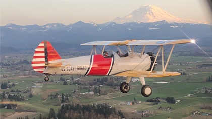Clint Cawley and his wife, Andrea, fly their Stearman, “Spirit of the Pacific,” before donating it to Dream Flights. (Photo courtesy of Clint Cawley.)