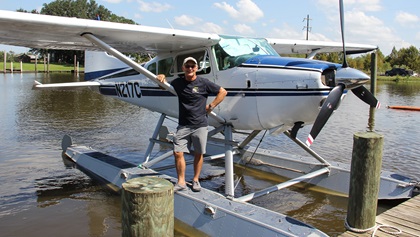 Mark Twombly, editor of <em>Water Flying</em> magazine, with a Cessna floatplane. Photo by Tom Snow.