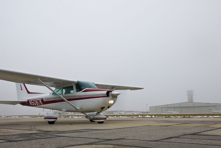 Cessna 172 sitting on the ramp in low visibility. Photo by Mike Fizer.