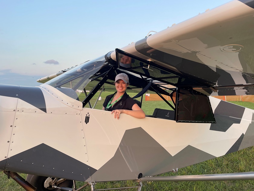 Cayla McLeod tries the Super Patriot on for size at Sun 'n Fun Aerospace Expo. Photo by Don Wade.