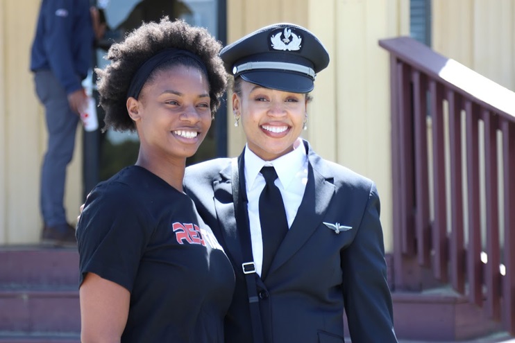 American Airlines First Officer Joi Schweitzer poses with a student from the Red Tail Scholarship Foundation during LFA’s Eyes Above the Horizon outreach program. Photo courtesy of Legacy Flight Academy.