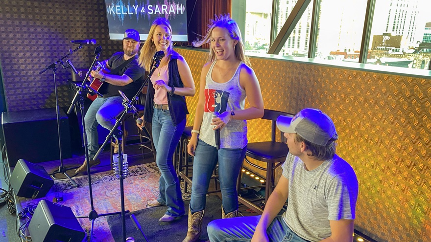Kelly and Sarah Finck wrap up an acoustic set at country music performer Blake Shelton’s Ole Red rooftop lounge in downtown Nashville, Tennessee, in June. Photo by David Tulis.
