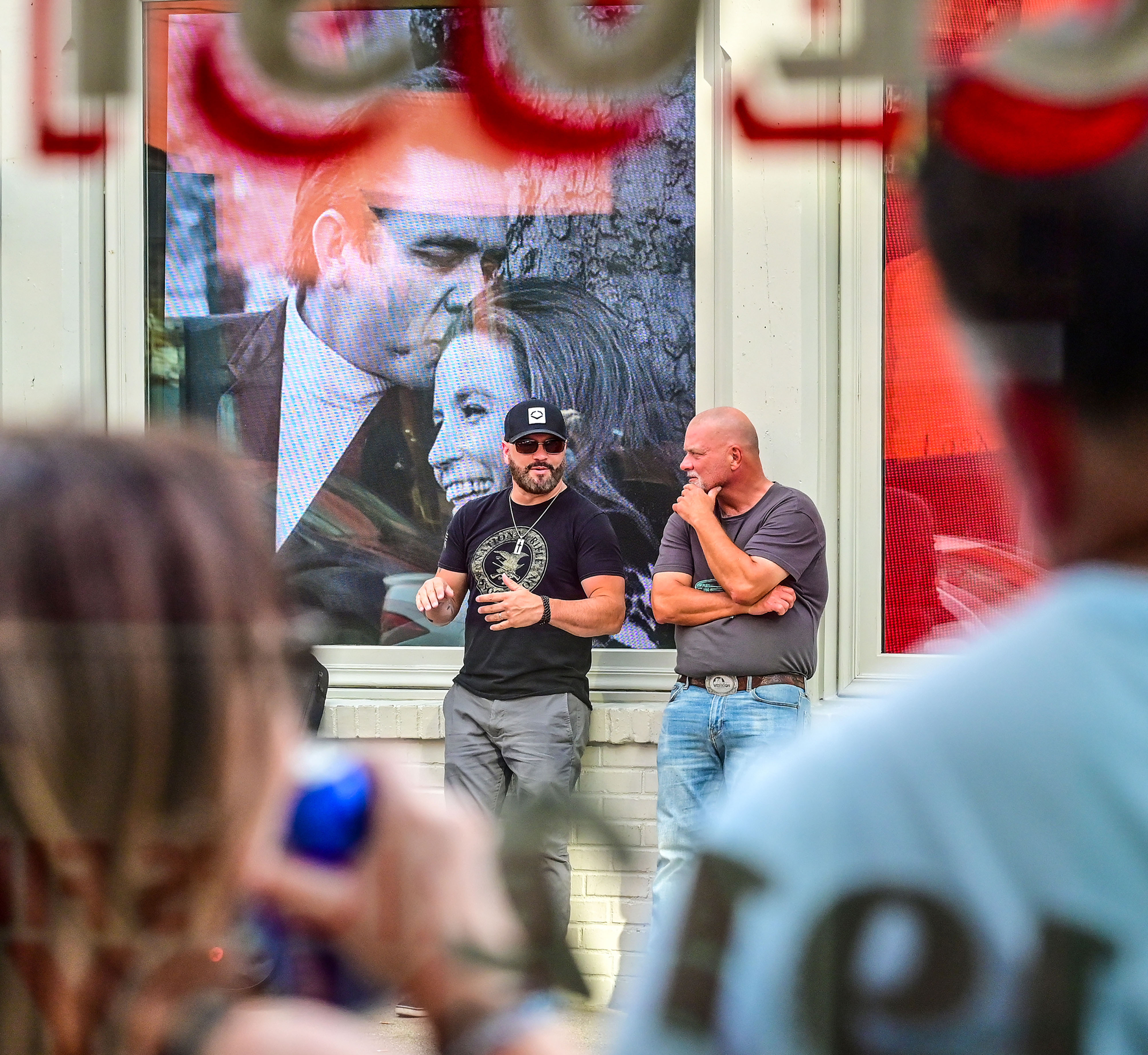 Legendary country musician Johnny Cash is remembered on the storefront of a Third Street bar and babecue restaurant. Photo by David Tulis.