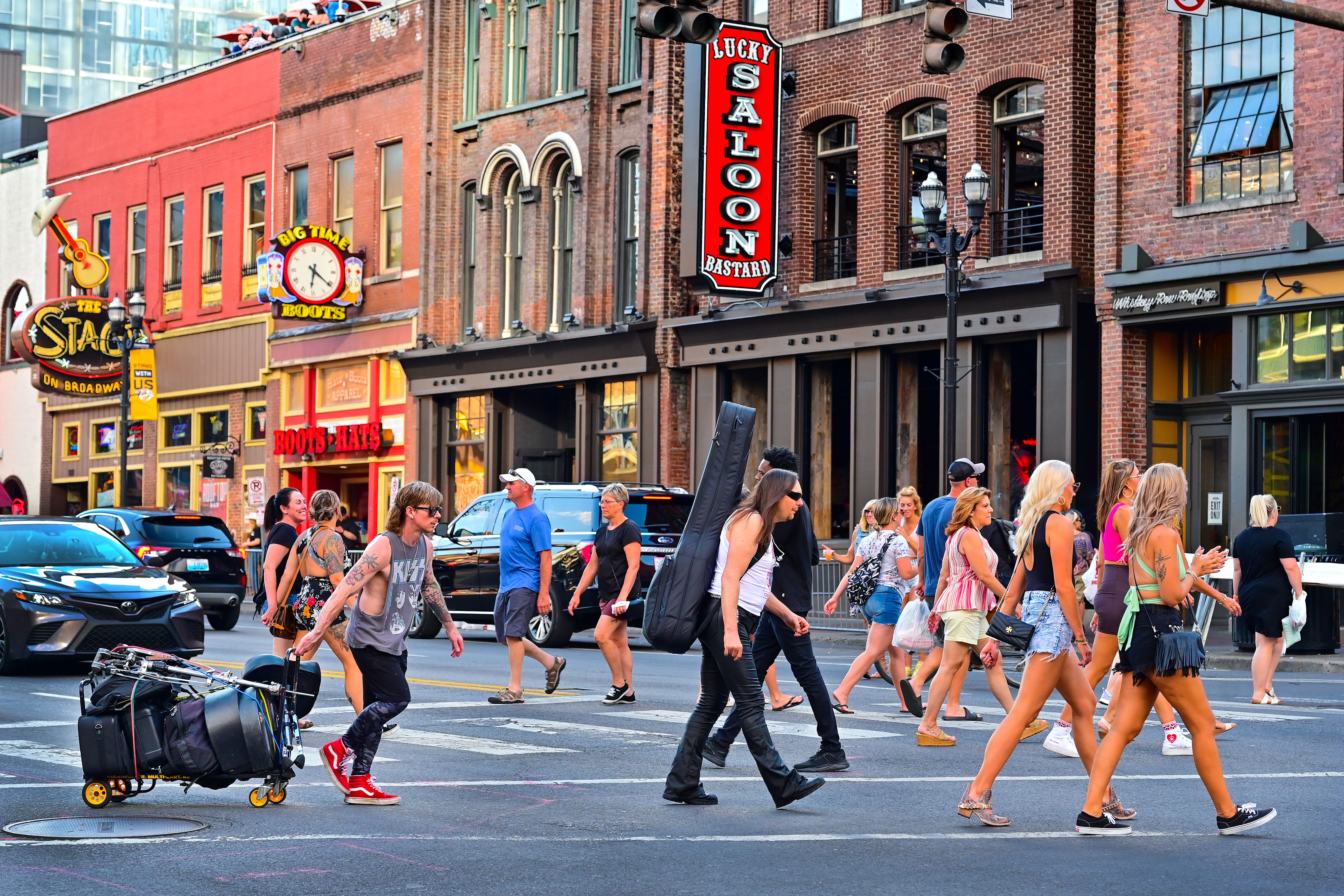 Where else can you spot guitar players and drummers mingling with visitors crossing Broadway along ‘Music Row’? Photo by David Tulis.