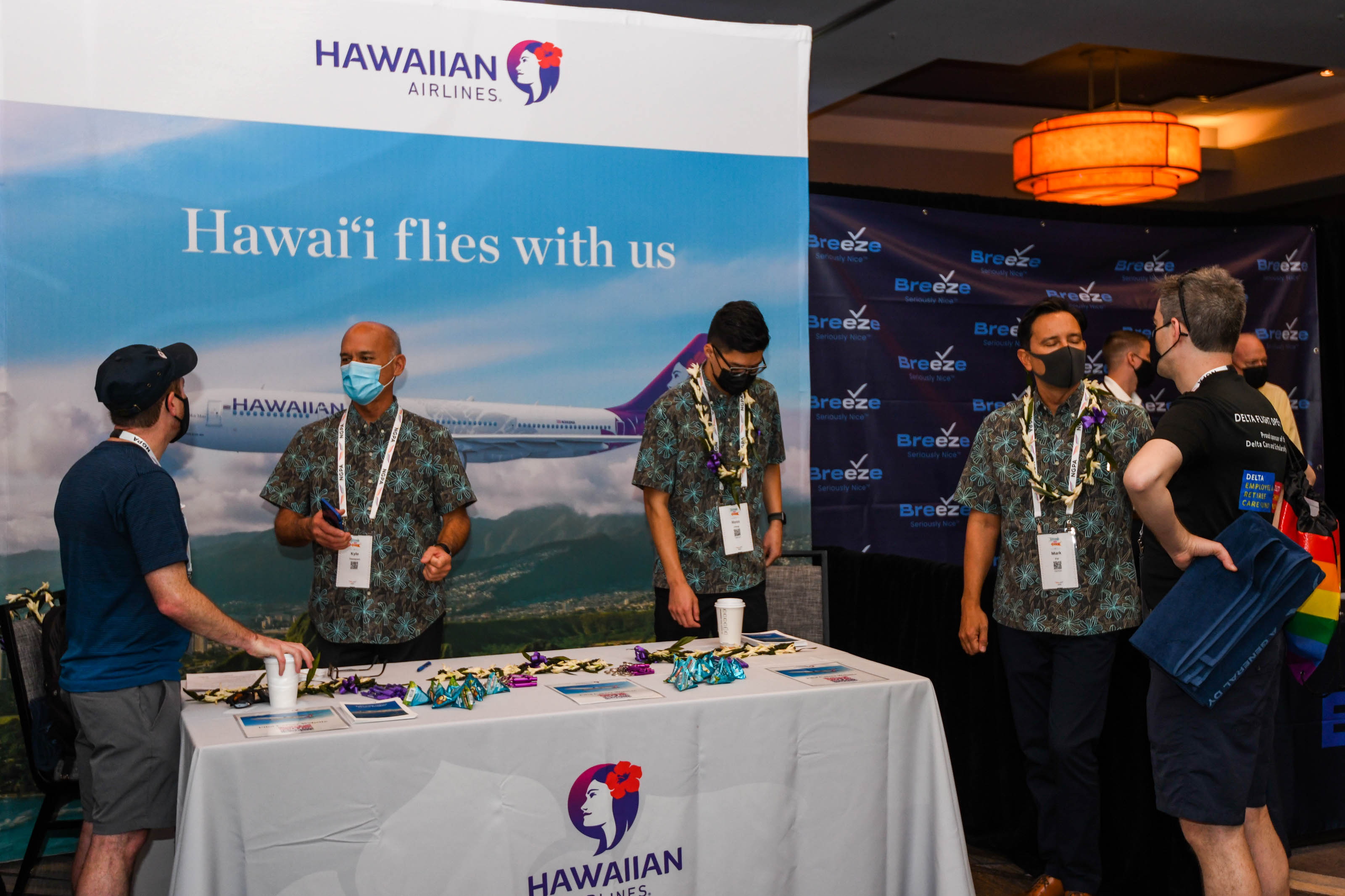 Hawaiian Airlines representatives speak with NGPA Industry Expo attendees at their booth in the exhibitor hall. Photo by Niki Britton.