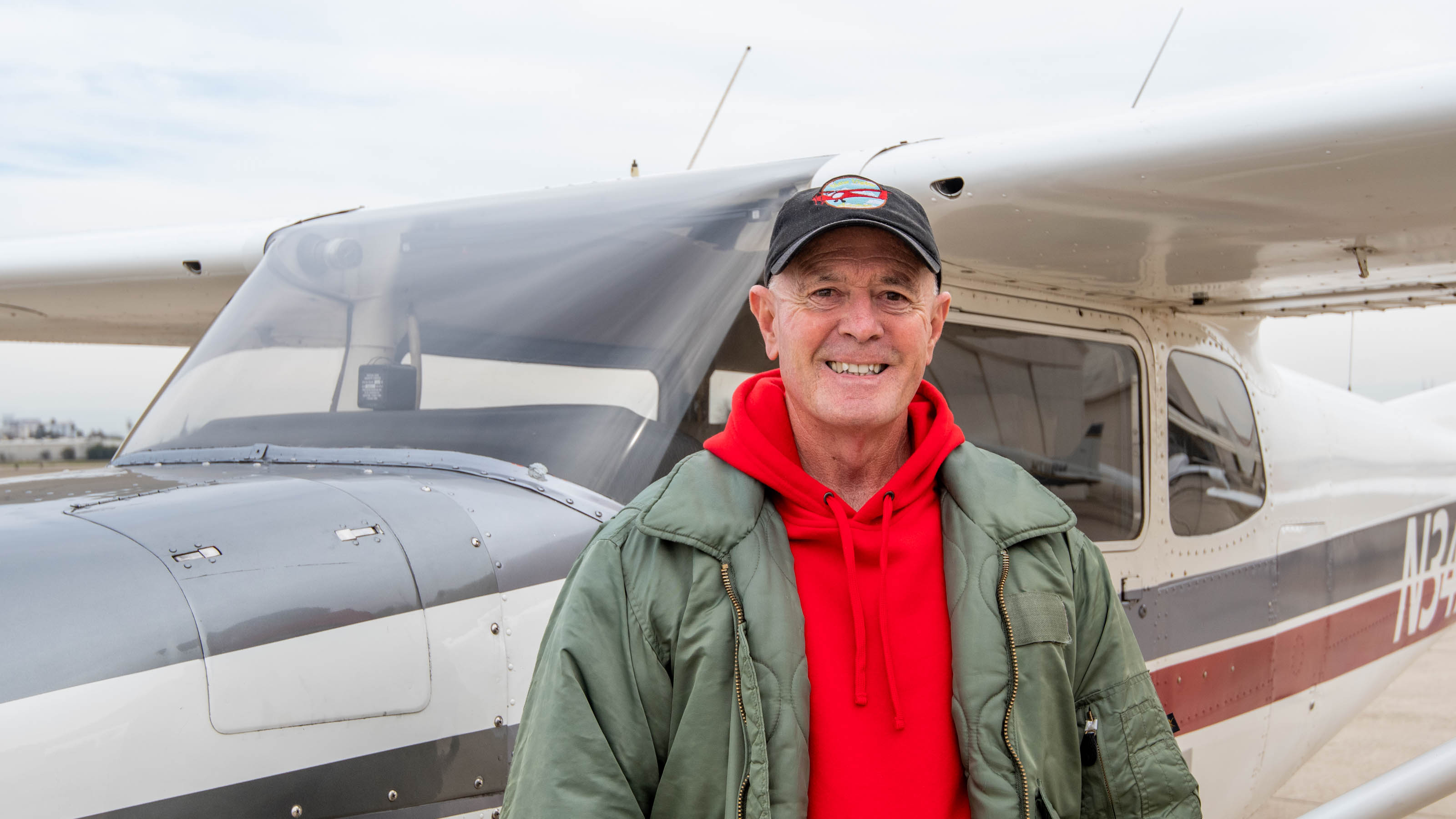 New Vision Aviation President and CEO Joseph Oldham stands in front of a 1960 Cessna 172B before taking students for an introductory flight. Photo by Niki Britton.