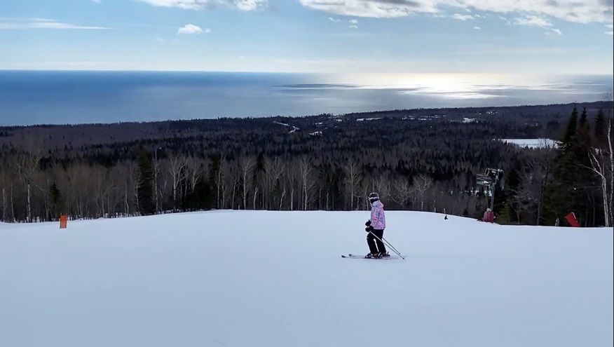 Cayla McLeod overlooking Lake Superior on the slopes of the Lutsen Mountains in Lutsen, Minnesota. Photo by Ryan Hunt.
