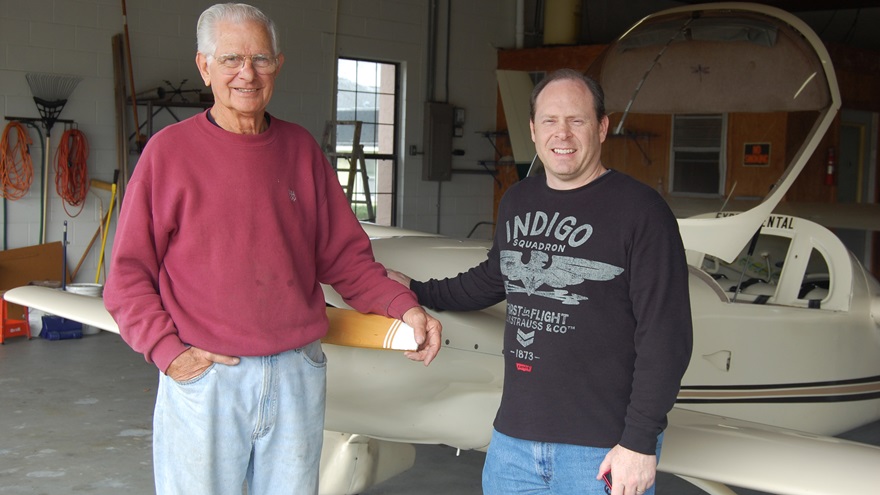 Chuck Ufkes, one of the Sky-Hi Flying Club's first members and presidents, and Secretary-Treasurer Scot Shealer, in Ufkes' Florida hangar in front of his home-built Dragonfly. Photo courtesy of Scot Shealer.