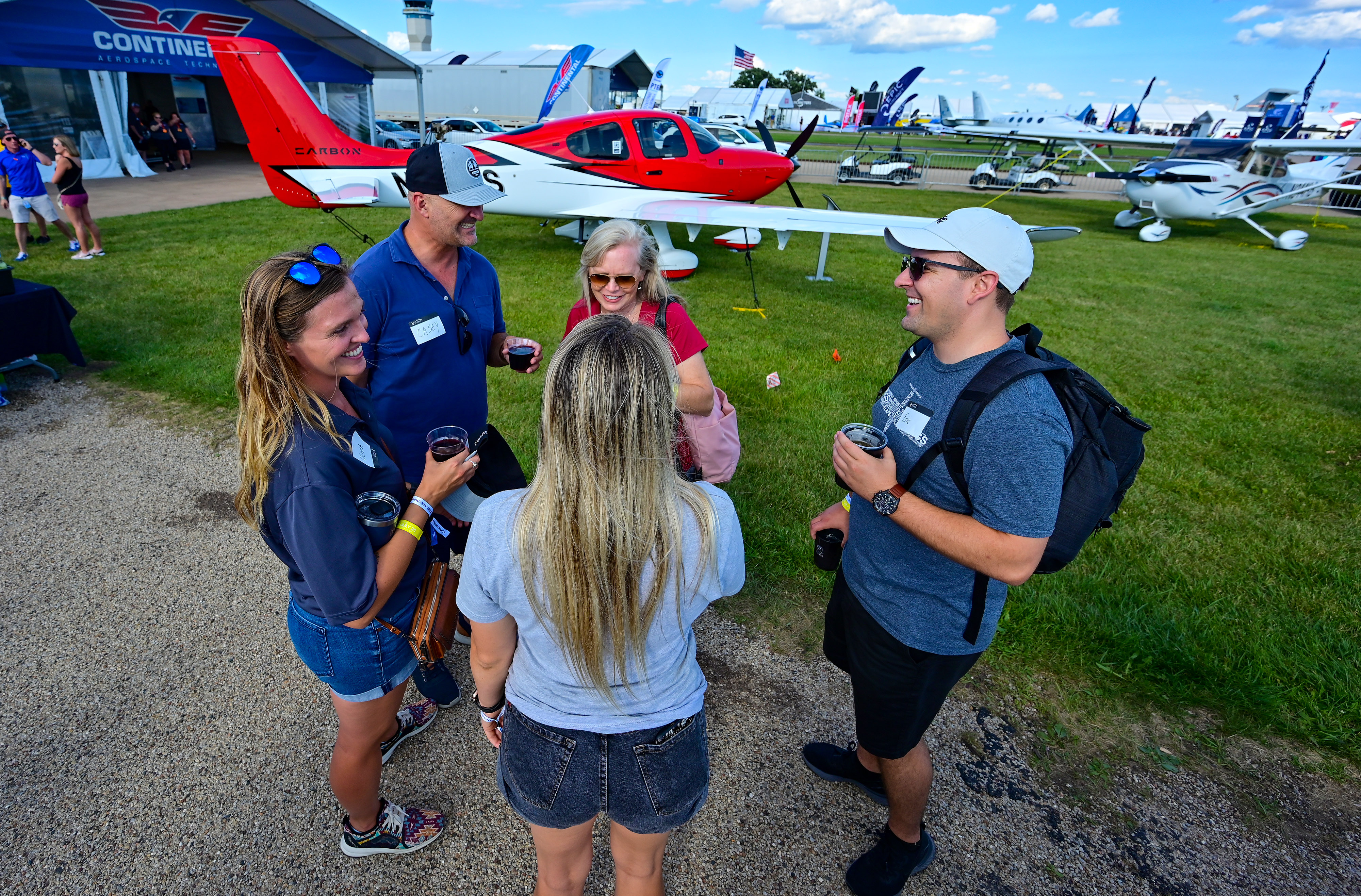 Pilots, exhibitors, and attendees arrive during EAA AirVenture July 24, 2022. Photo by David Tulis.