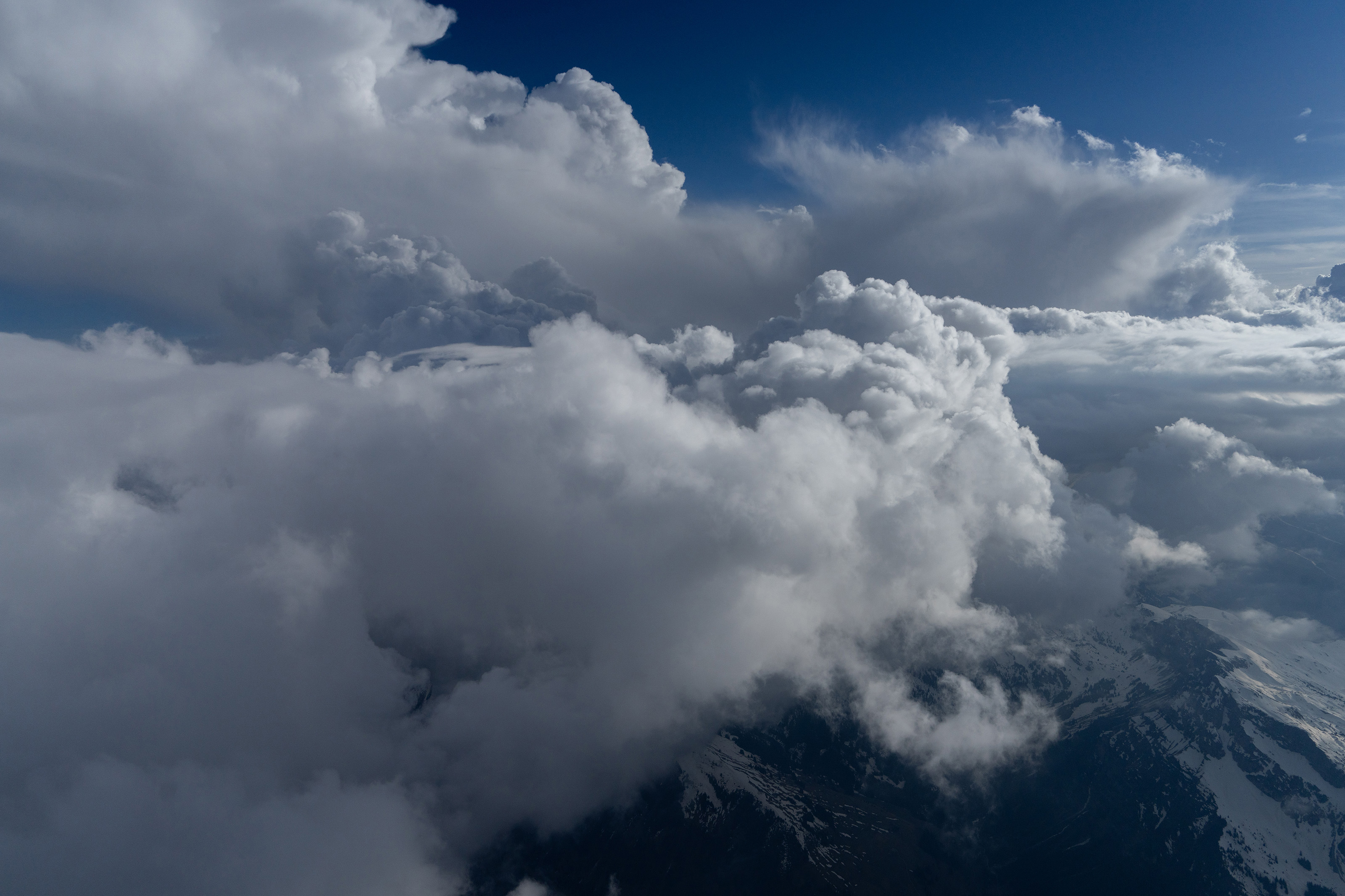 North of the storm, over the Simmental Valley at FL130, watching training development along the Bernese Alps ridge. Photo by Garrett Fisher.