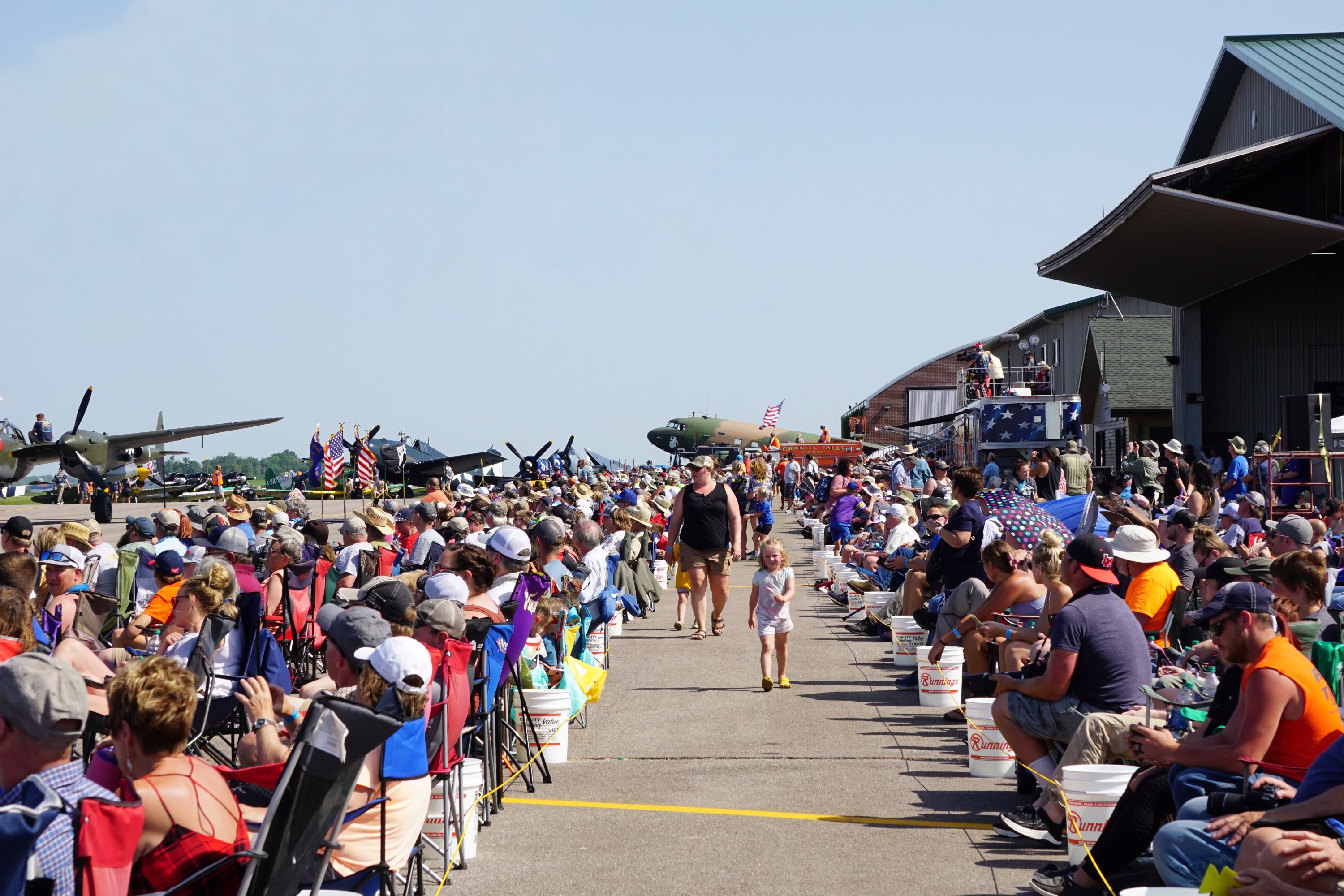 Although hot and windy, nearly 15,000 people gathered at the small-town Minnesota airport for a day of action-packed aviation fun. Photo by Cayla McLeod Hunt.