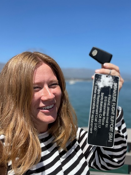 Juliette Simpkins holds the keys to Signature Flight Support’s crew car. With a keychain like that, they’re almost impossible to fly away with. Photo by Alicia Herron.