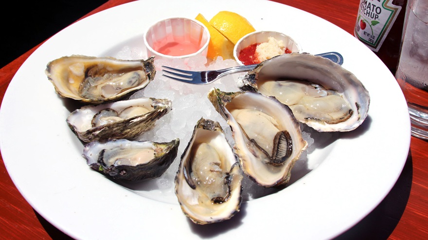 Half a dozen umishi oysters, briny and refreshing. First-timers may benefit from adding mignonette or horseradish before slurping one down. Photo by Alicia Herron.