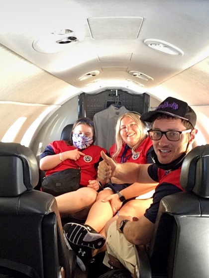 Special Olympics USA Games powerlifters Alexa Akin and Brian Beirne, with coach Amanda Bendorf, participate in a Textron Aviation-sponsored Special Olympics Airlift flight from New Jersey to Florida. Photo by Luz Beattie.
