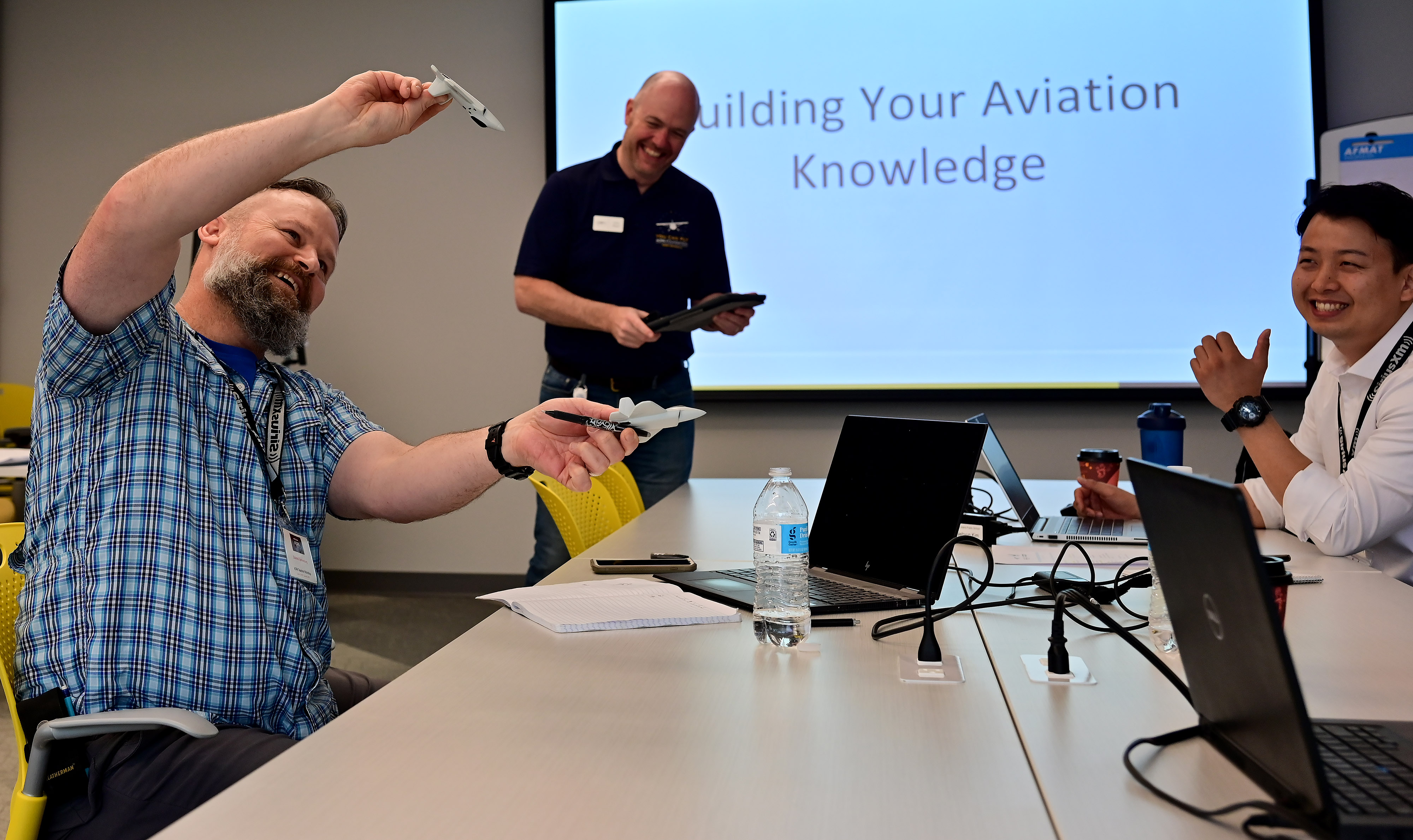 High school educators Ed Sponenburg and Jaehyun Kim participate in an interactive hands-on workshop with AOPA Senior Director of Flight Training Education Chris Moser in Frederick, Maryland, June 14, 2022. Photo by David Tulis.