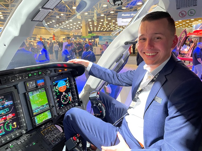 Bell sales representative Errick Smith sits in a Bell 429 helicopter at Helicopter Association International’s Heli Expo in Dallas. Photo by Cayla McLeod. 