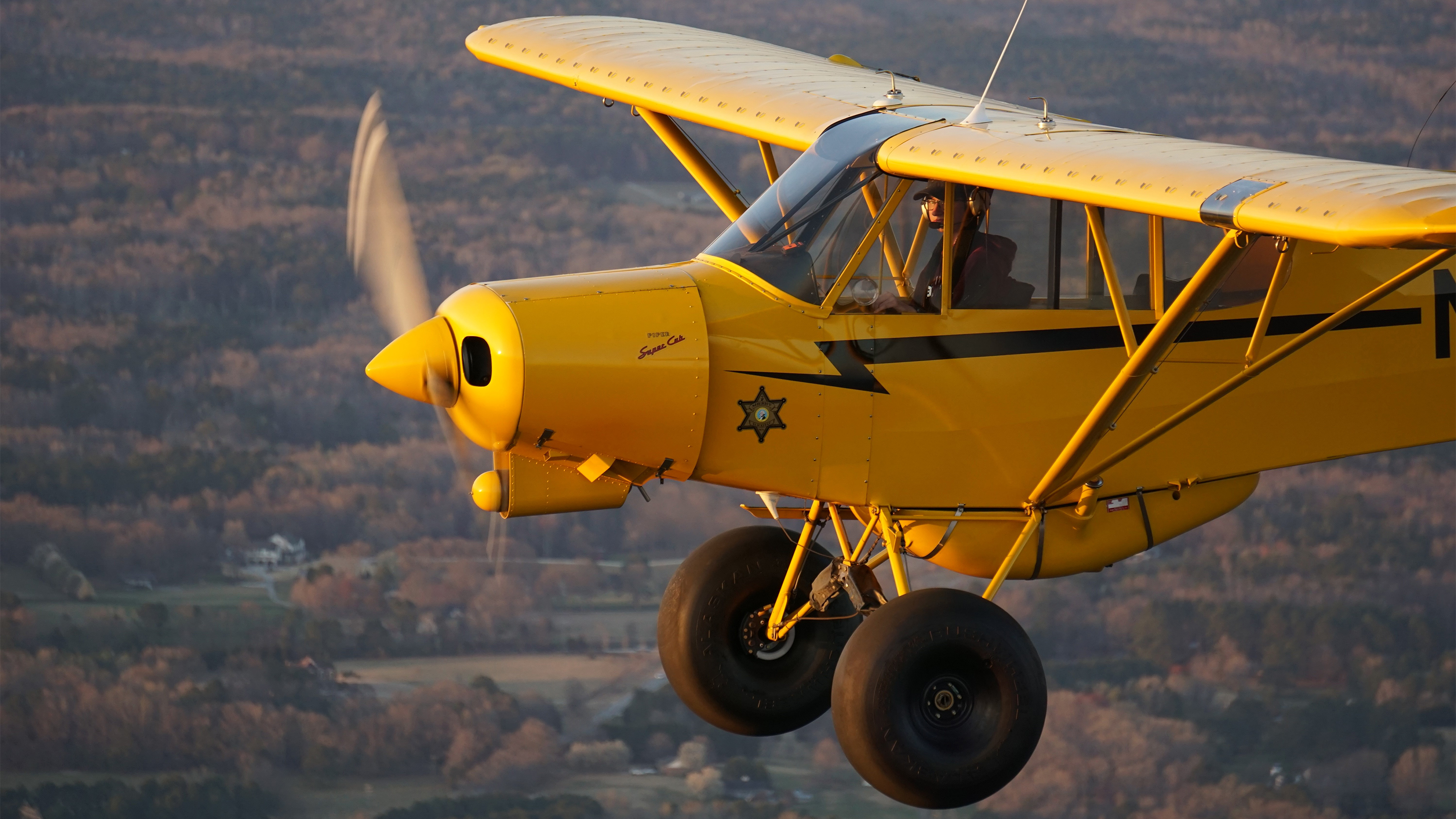 Adam Sarsfield aloft in his Super Cub solo for the very first time. Photo by Cayla McLeod. 