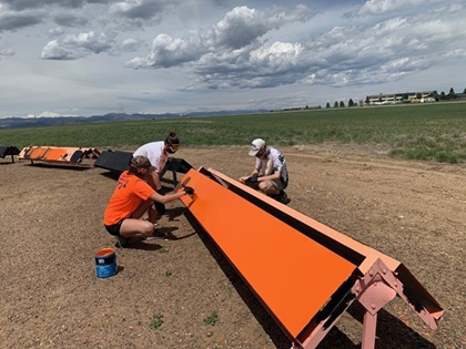 Volunteers for Andrew Walker’s Eagle Scout project work on the segmented circle at Rocky Mountain Metropolitan Airport. Photo courtesy of Andrew Walker. 